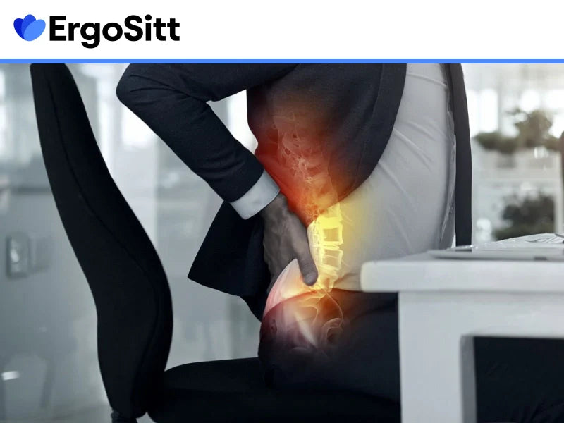 Man med ryggsmärta vid kontorsstol – behov av ergonomiskt ryggstöd